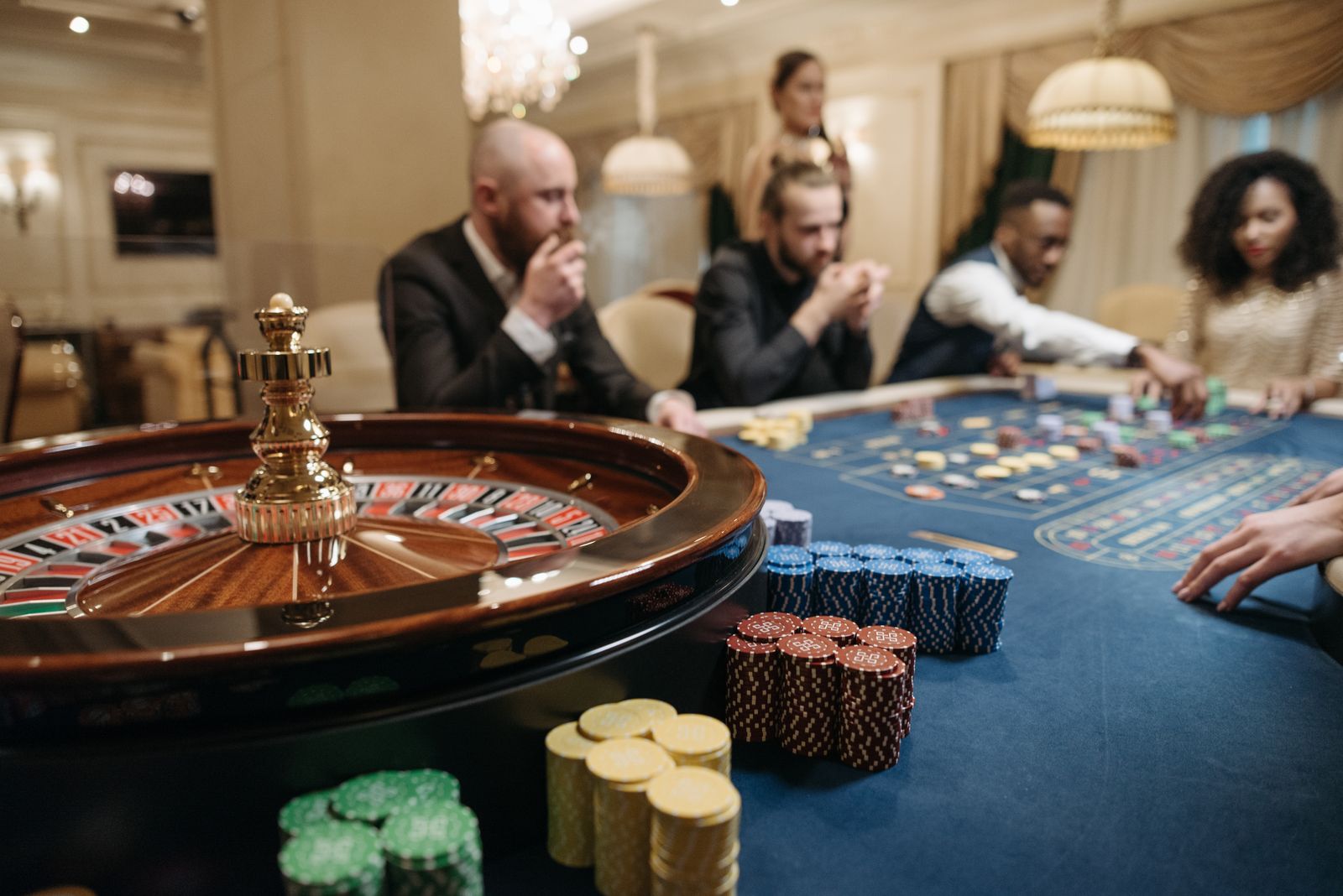 A roulette table with chips stacked on it