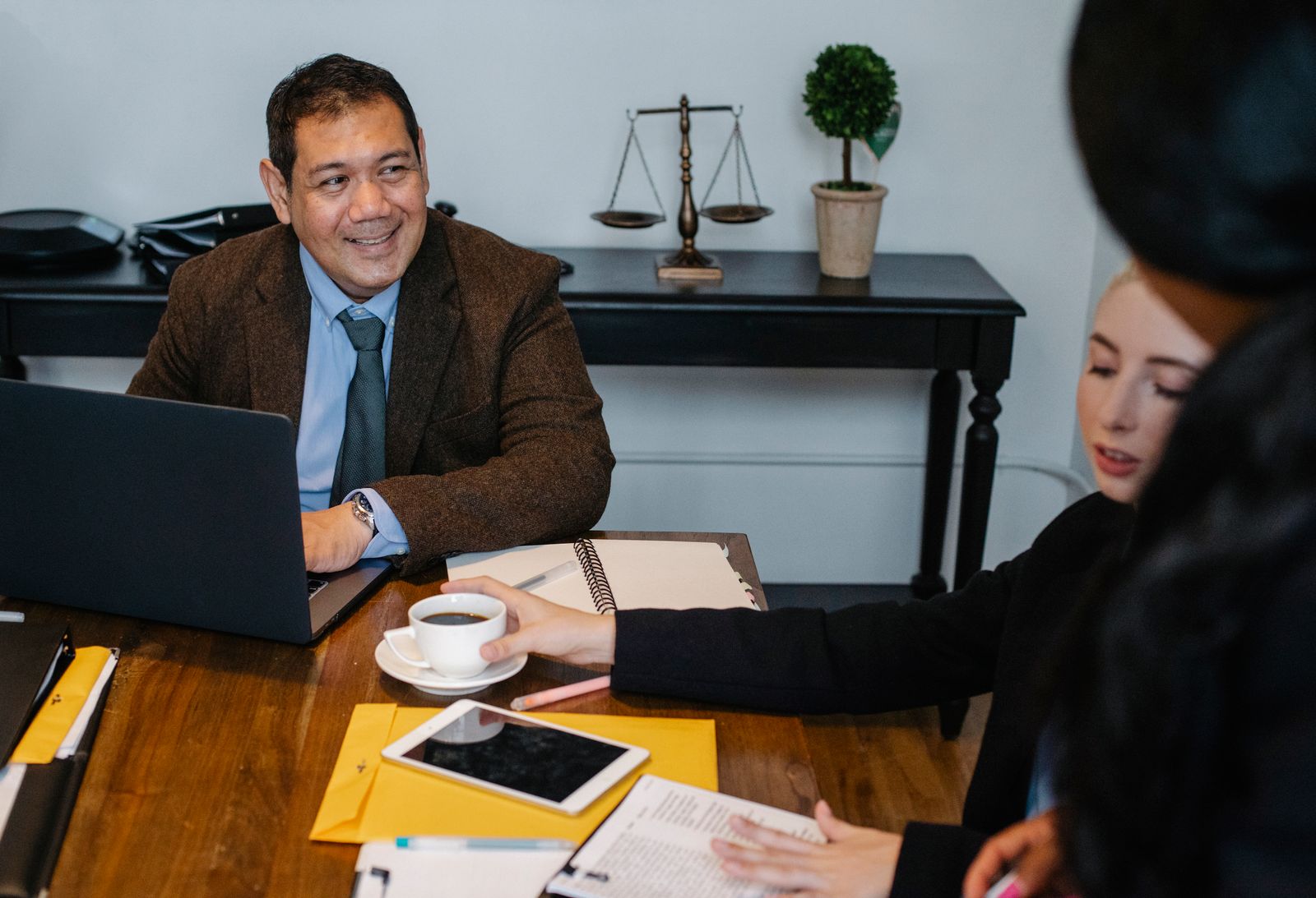 A small team reviewing a contract in a meeting room