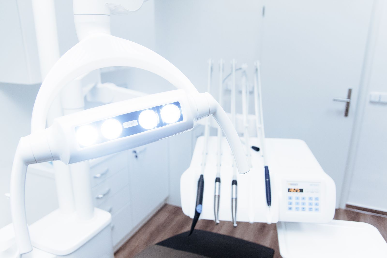 A treatment room in a modern clinic, equipment ready and unattended