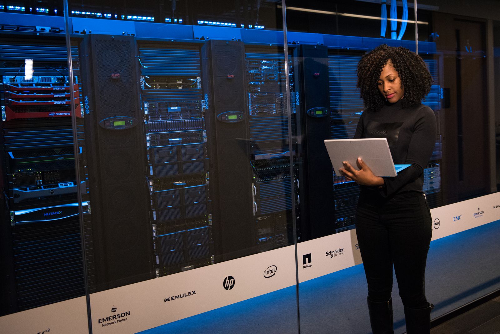 An engineer working at a rack in a server room