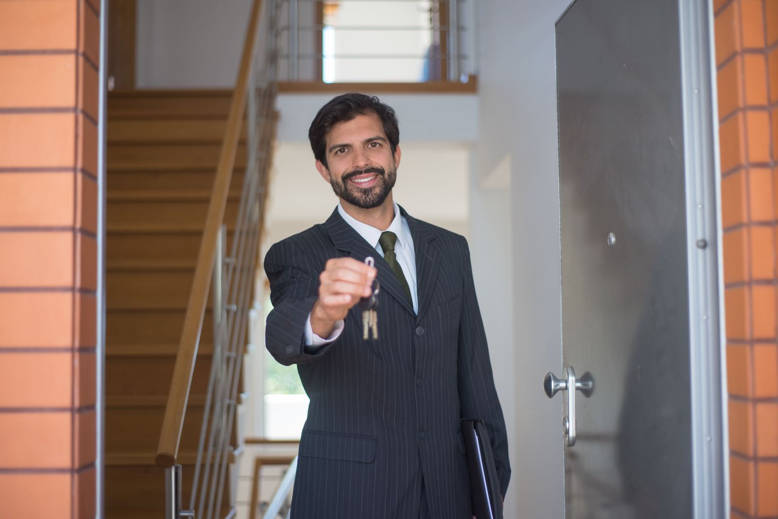 An agent handing over the keys to a property